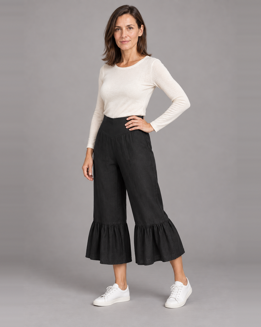 Bryn Walker Ruffle Pant in Black, light linen, front view on model