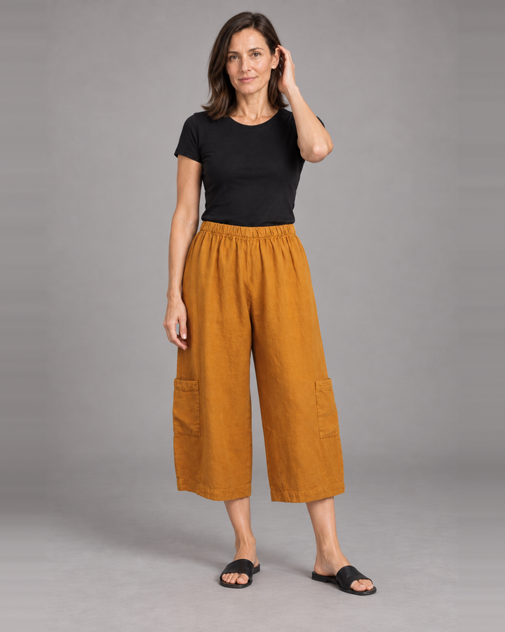 Bryn Walker Casbah Pant in Persimmon, heavy linen, front view on model