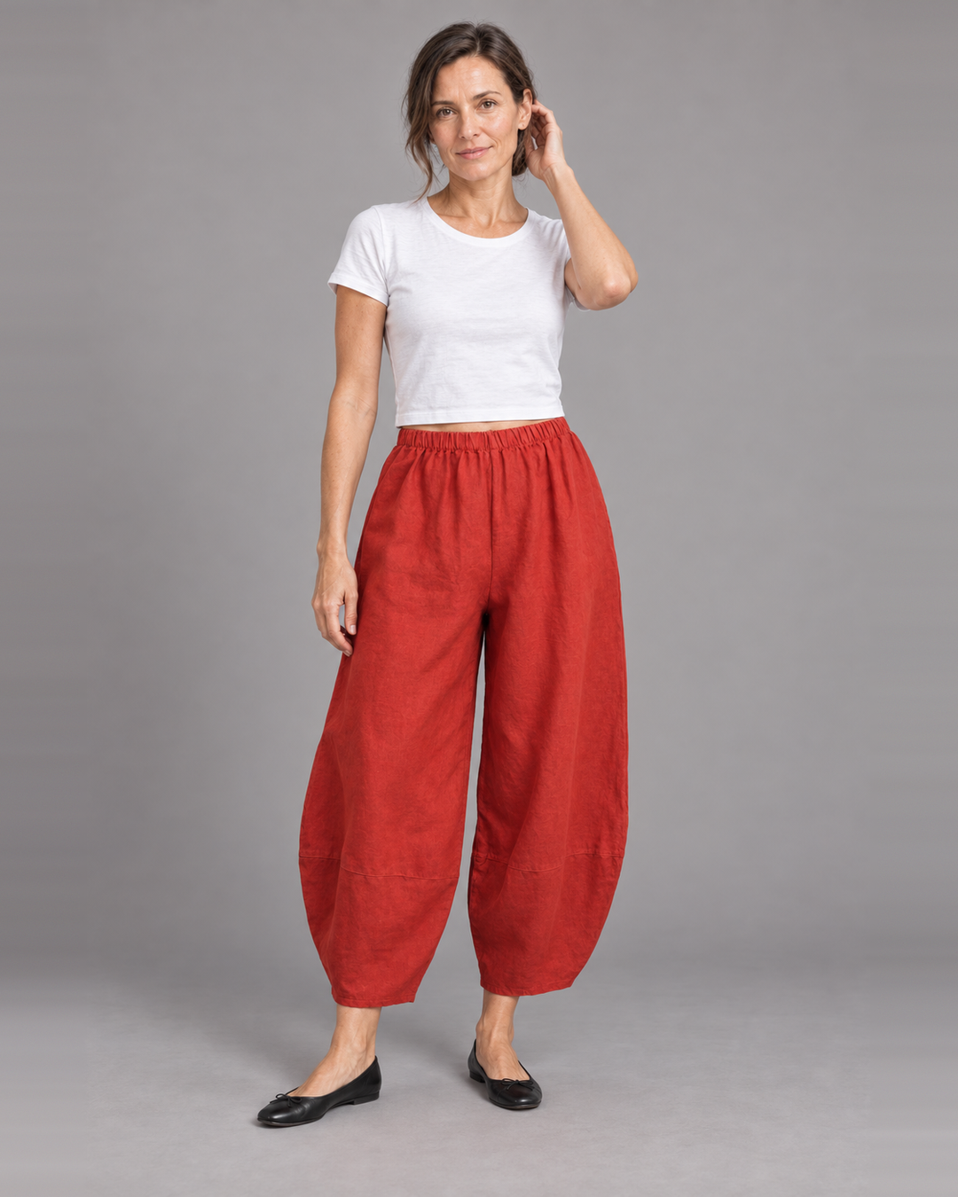 Bryn Walker Oliver Pant in Rambutan, heavy linen, front view on model
