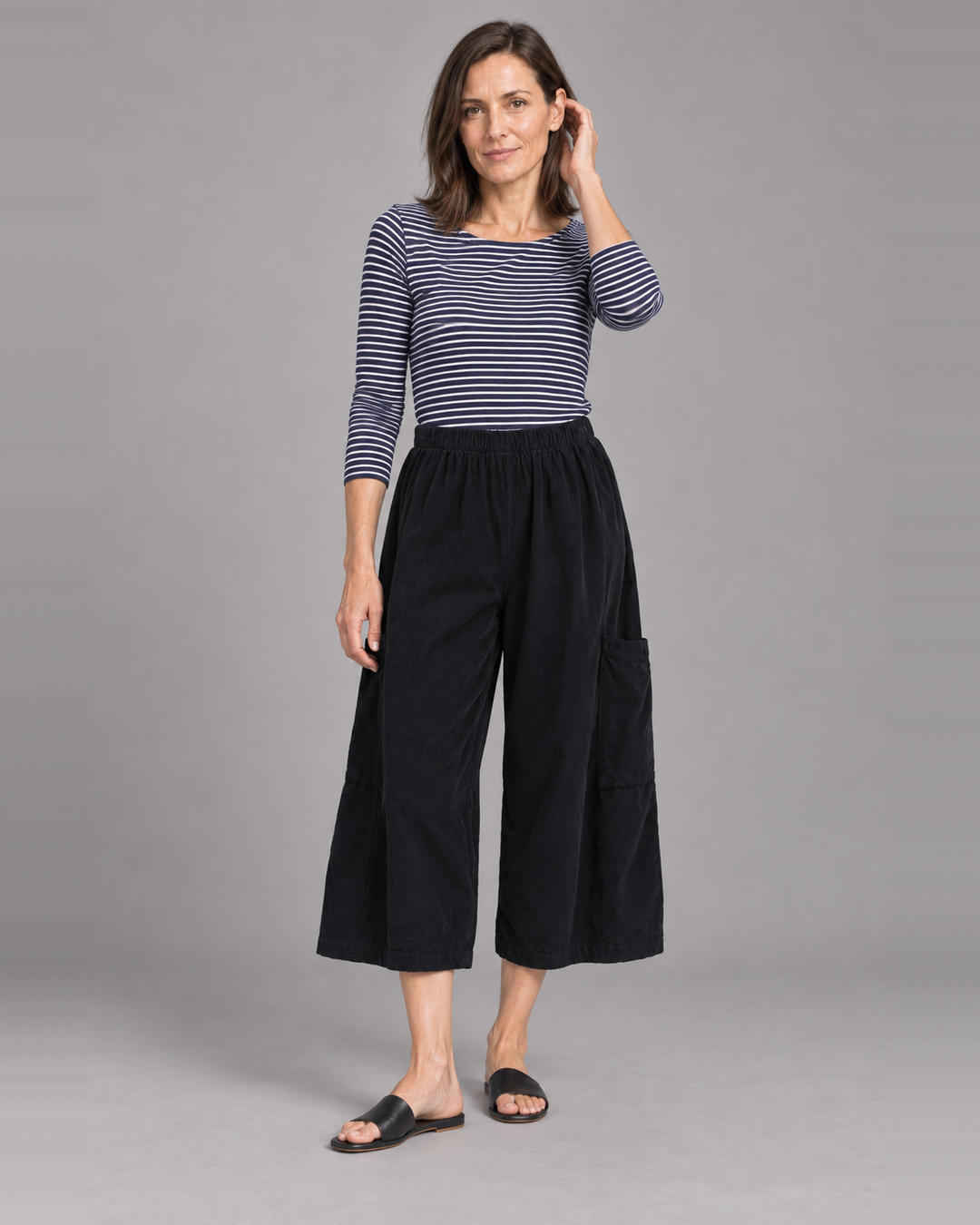 Bryn Walker Pasha Pant in Black, granada corduroy, front view on model