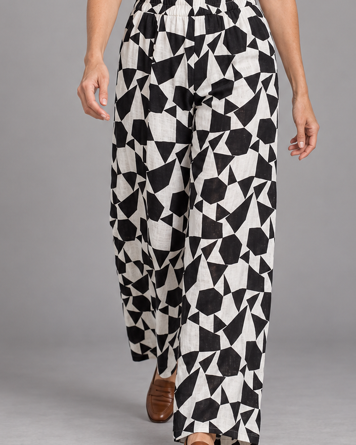 Bryn Walker Osca Pant in Cream, print light linen, detail view on model