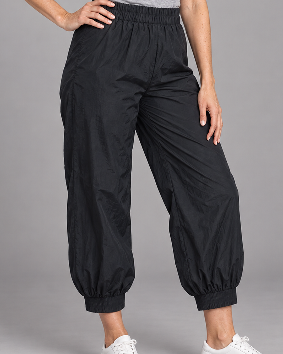 Bryn Walker Wyatt Pant in Black, memory crunch, detail view on model