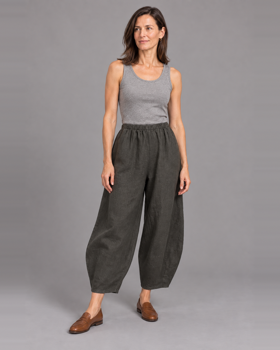 Bryn Walker Oliver Pant in Kelp, heavy linen, front view on model