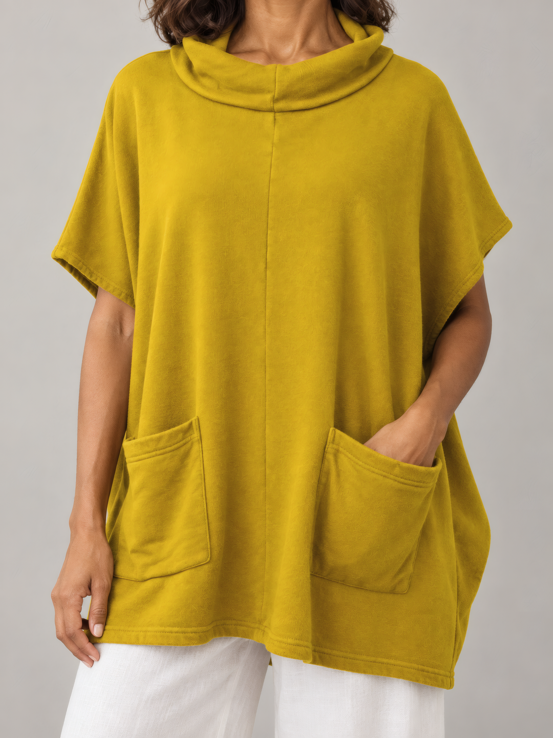 Bryn Walker Bamboo Fleece Pip Poncho in Dandelion, close up of the fabric and details