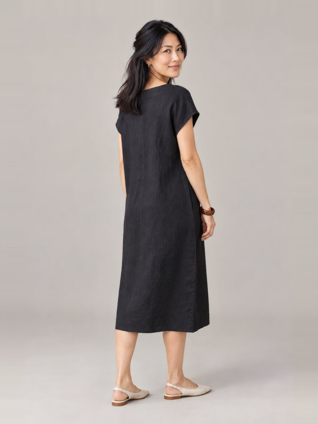 Bryn Walker Light Linen Ansley Dress in Black, back view on model