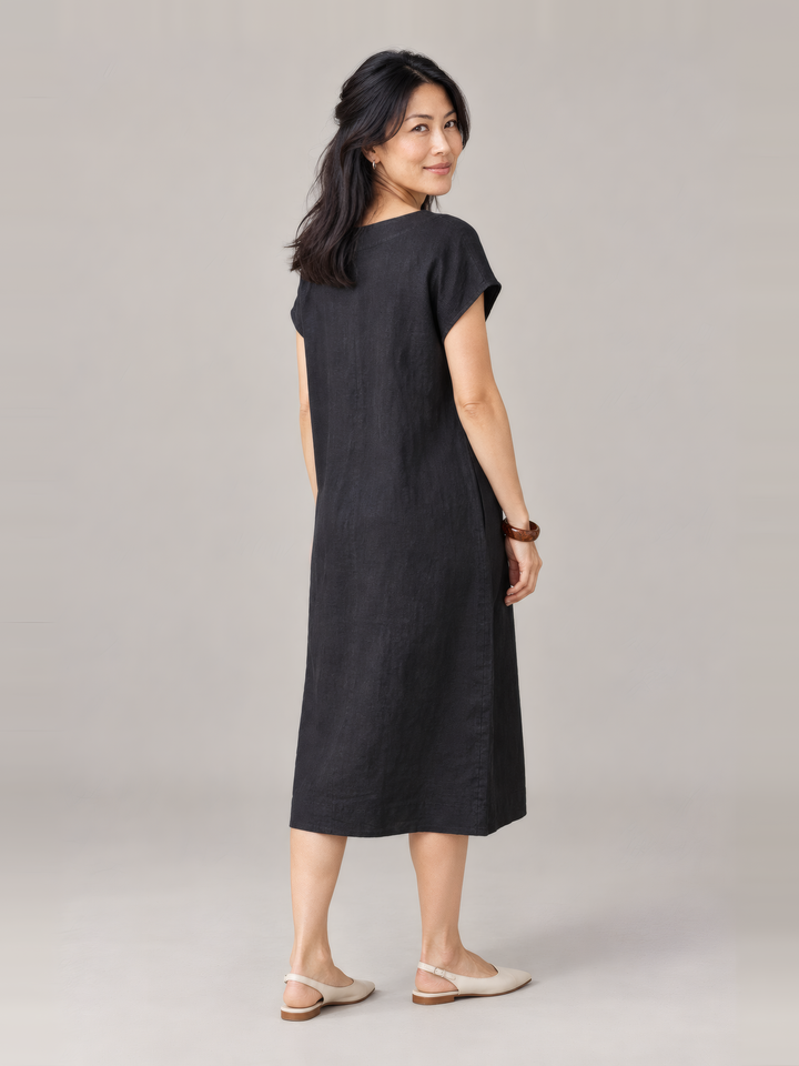 Bryn Walker Light Linen Ansley Dress in Black, back view on model