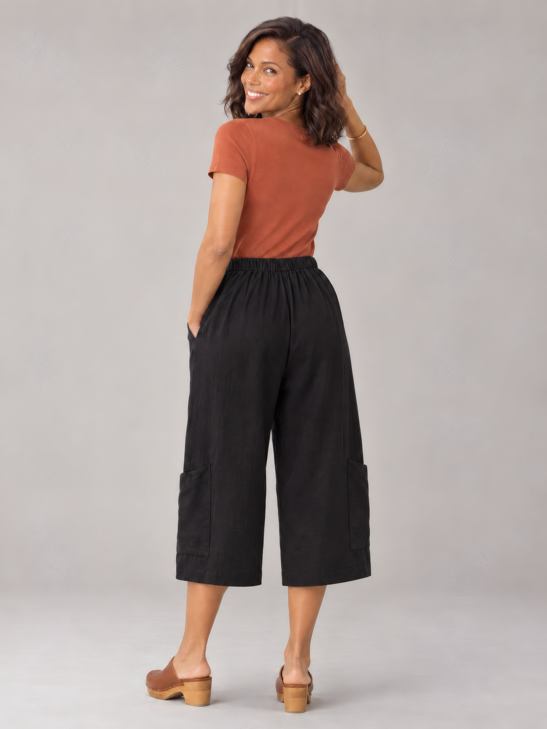 Bryn Walker Light Linen Casbah Pant in Black, back view on model