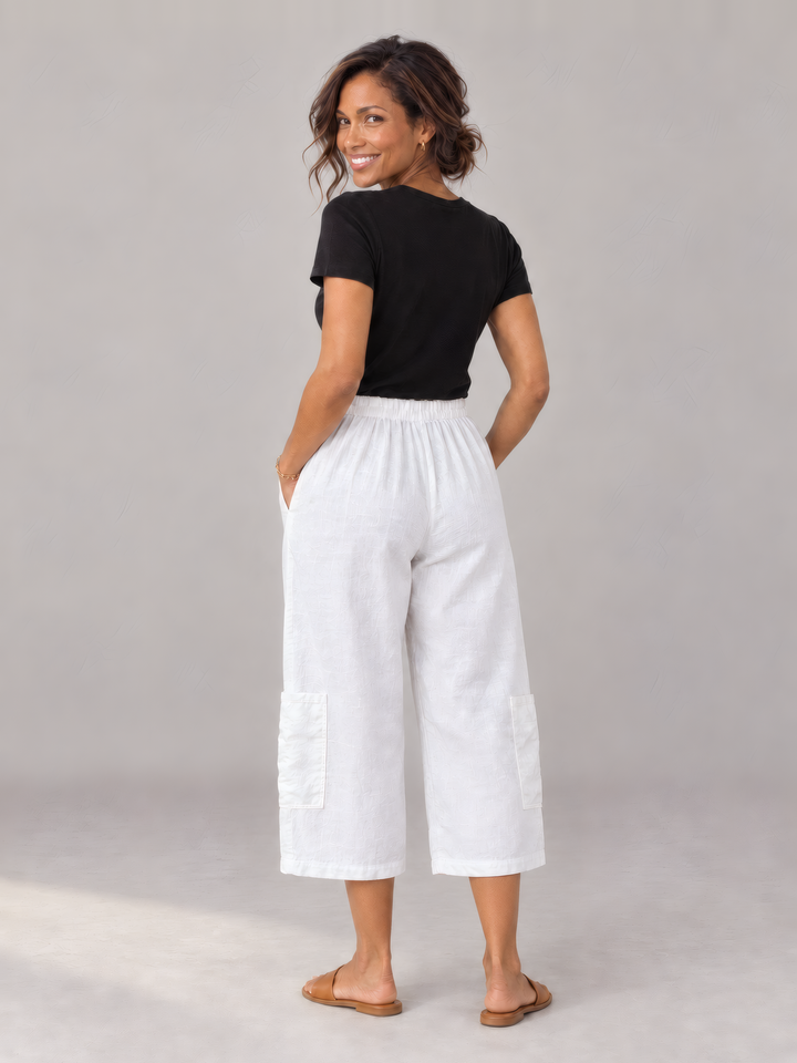 Bryn Walker Light Linen Casbah Pant in White, back view on model