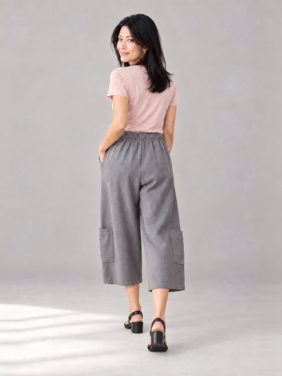 Bryn Walker Light Linen Casbah Pant in Zinc, back view on model