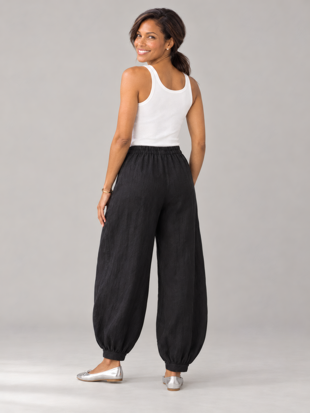 Bryn Walker Light Linen Genie Pant in Black, back view on model