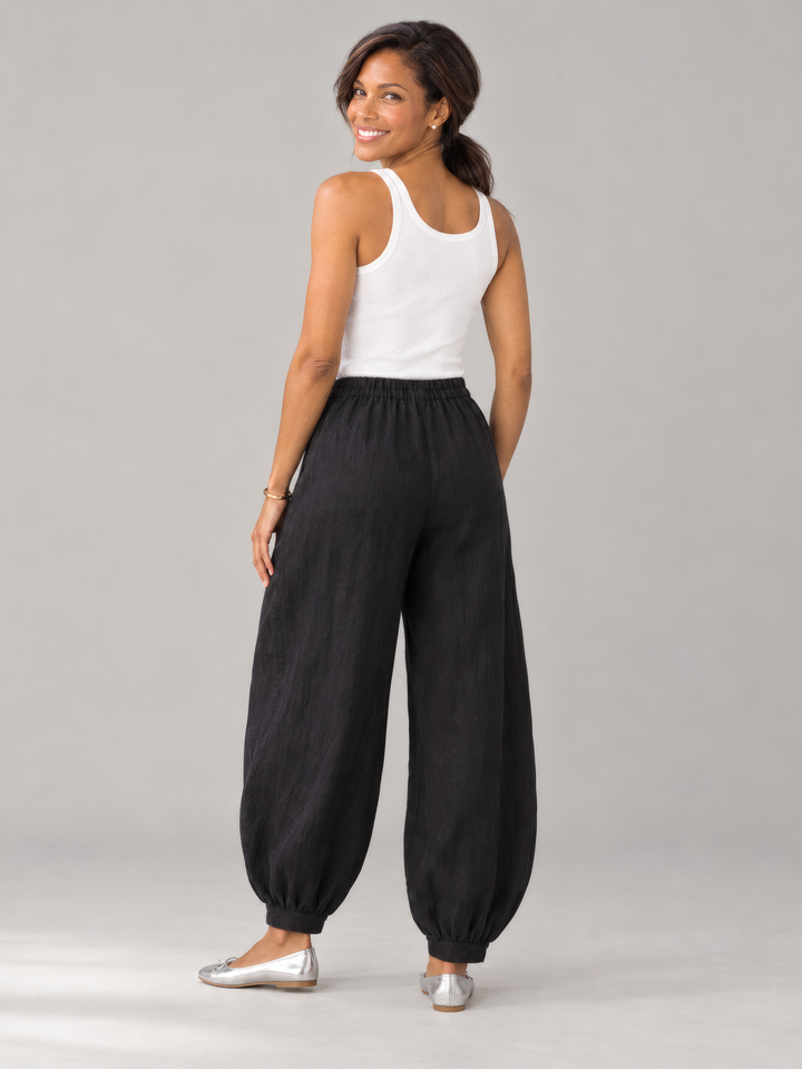 Bryn Walker Light Linen Genie Pant in Black, back view on model