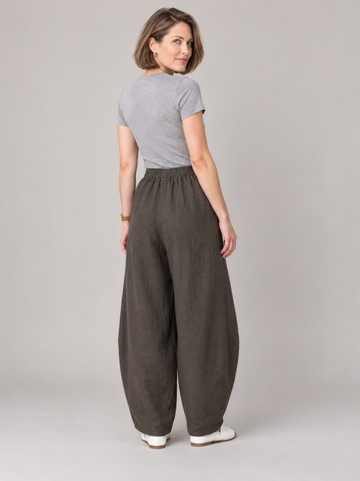 Bryn Walker Light Linen Oliver Pant in Peppercorn, back view on model