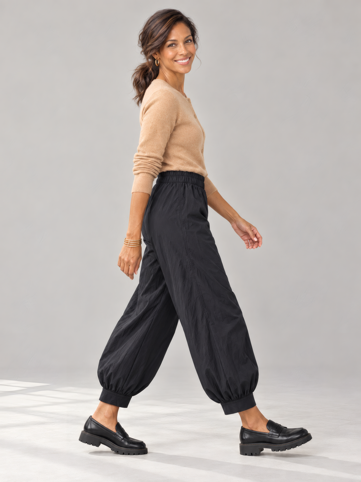Bryn Walker Memory Crunch Wyatt Pant in Black, side view on model