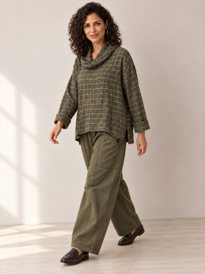 Eleven Stitch Design By Gerties Cowl Pullover in African Olive, on model, second angle