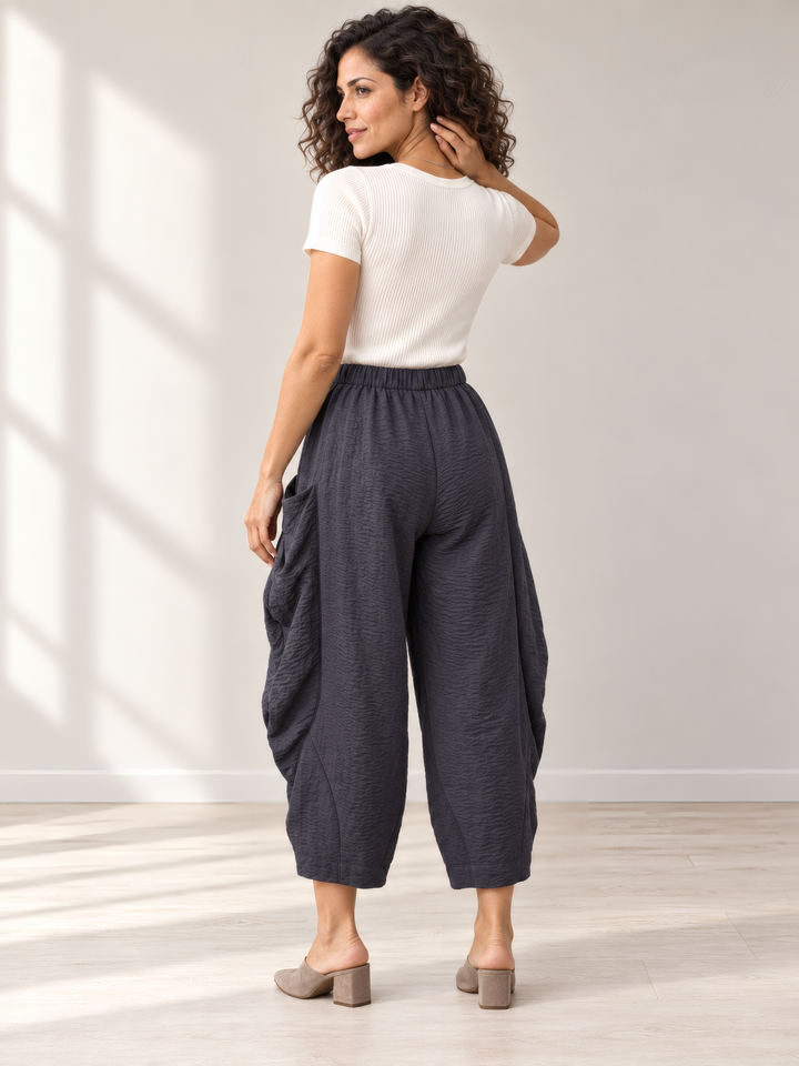 Eleven Stitch Design By Gerties Double Pocket Pant in Black Pearl, back view on model