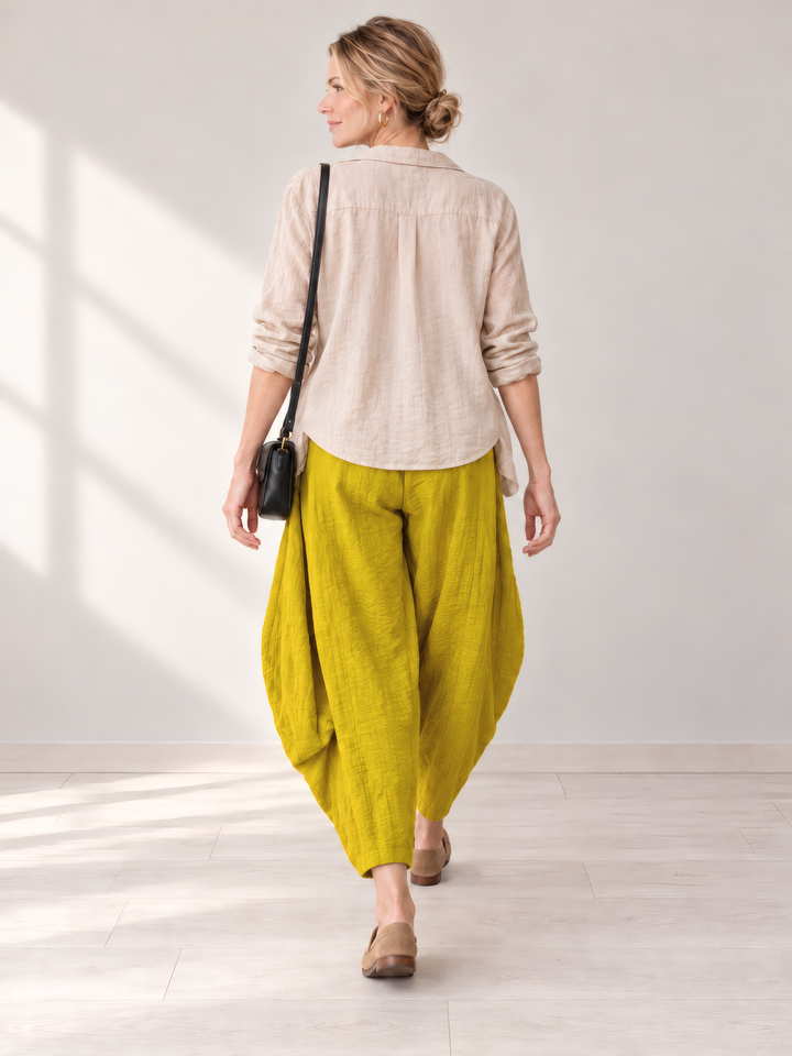 Eleven Stitch Design By Gerties Double Pocket Pant in Mustard, back view on model