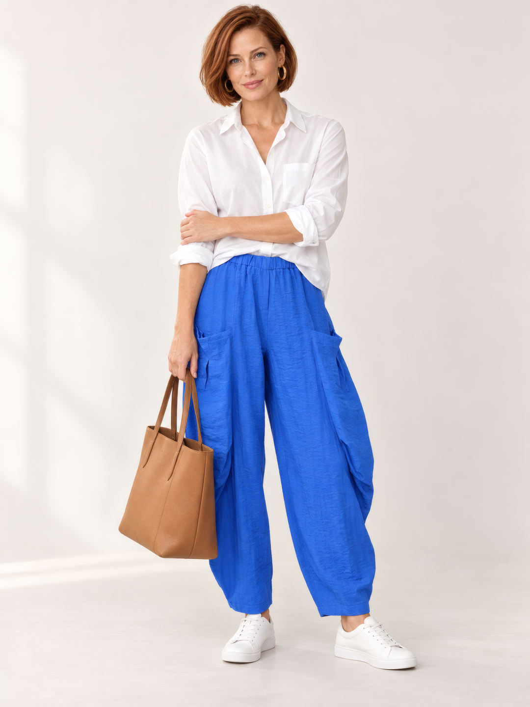 Eleven Stitch Design By Gerties Double Pocket Pant in Ocean, front view on model