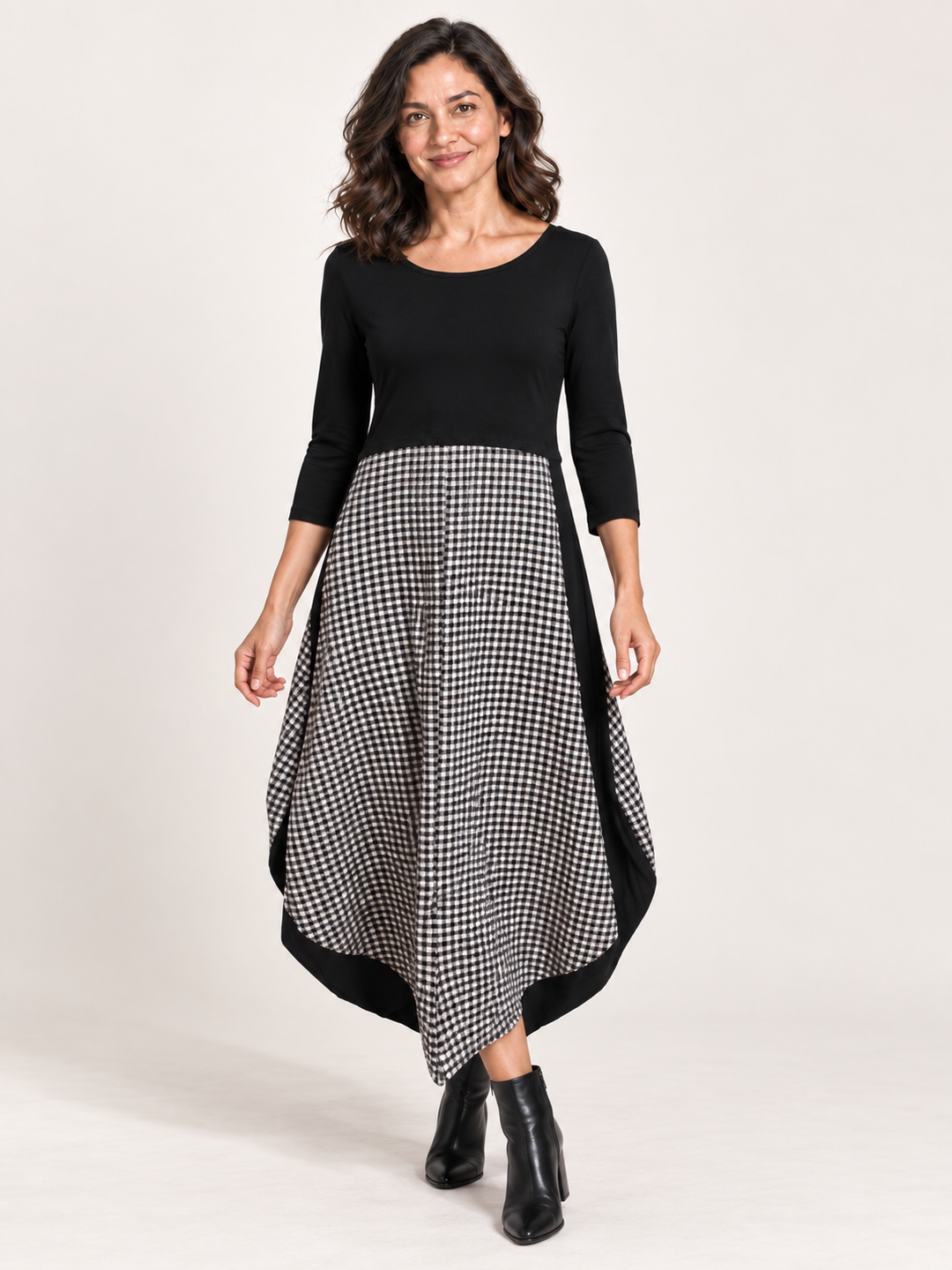 Kozan Jessica Dress in Check, black bodice with black and white check skirt and pointed hem, front view on model