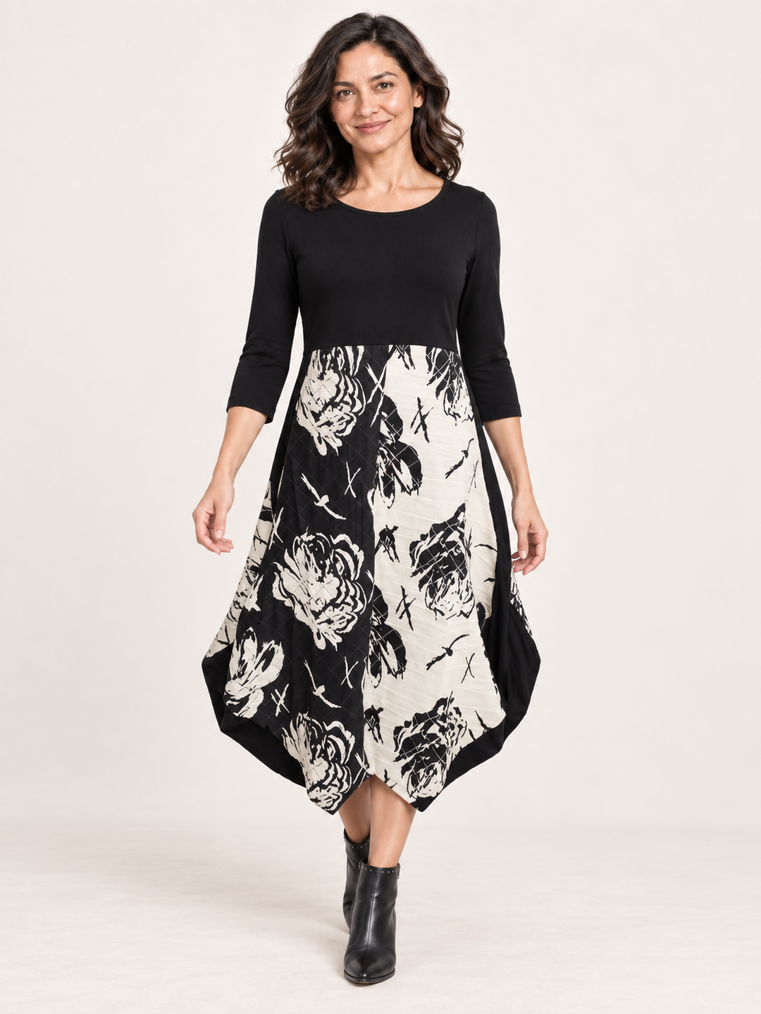 Kozan Jessica Dress in Eden, black jersey bodice with black and cream rose print skirt and pointed hem, front view on model