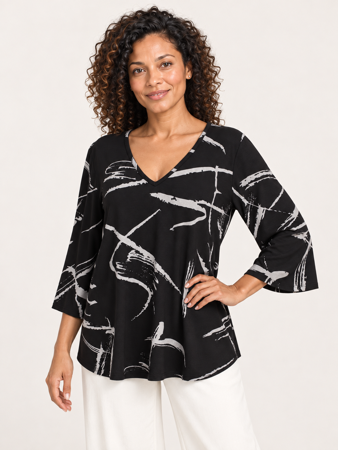 Kozan Juliana Top in Strike, V neck stretch jersey with gray brushstroke print on black, front view on model