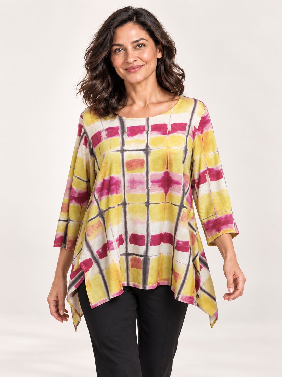 Kozan Juliette Top in Bali, boxy yellow and pink tie dye top with notched hem, front view on model