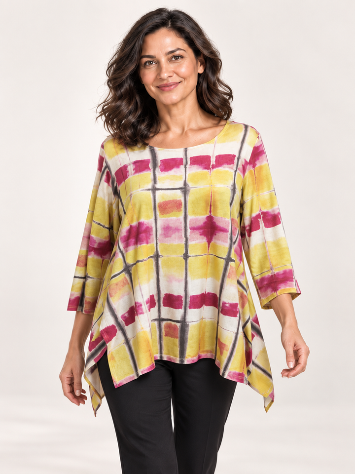 Kozan Juliette Top in Bali, boxy yellow and pink tie dye top with notched hem, front view on model