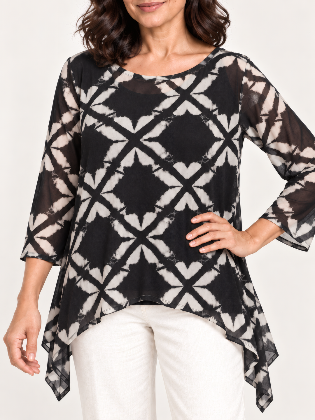 Close up of Kozan Mila Topper in Optic, black and cream geometric print mesh and neckline