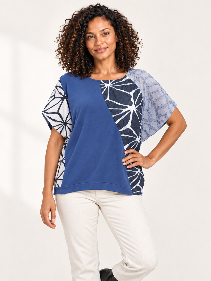 Kozan Salem Top in Sky, boxy short sleeve blue top with white and black print applique, front view on model