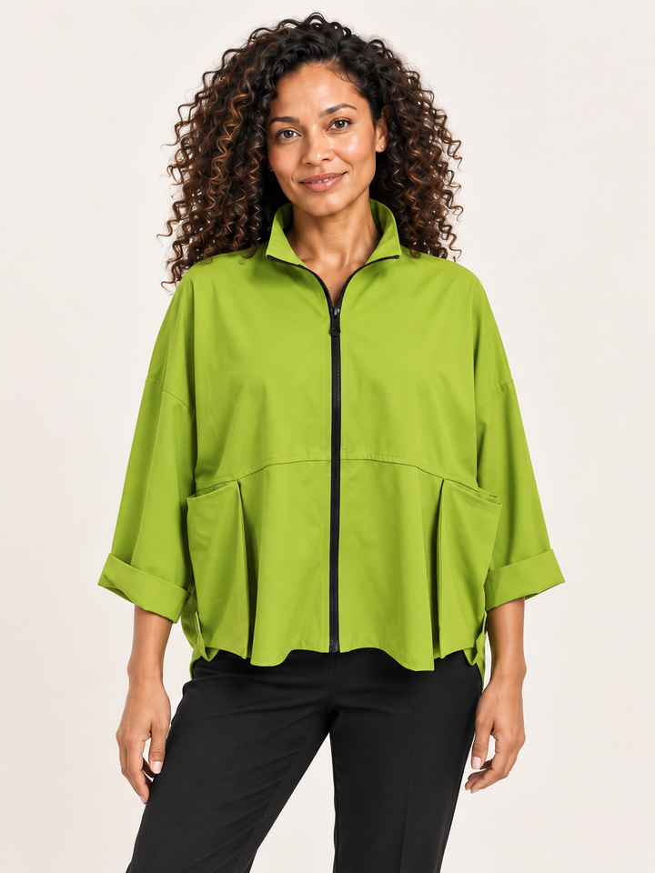 Kozan Vance Jacket in Chartreuse, zip front jacket with stand collar and large pleated pockets, front view on model