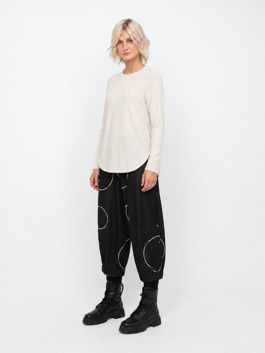 Ozai N Ku Circle Pant in Black, three quarter view on model